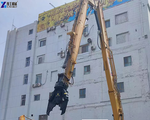 excavator shear demolishing concrete building