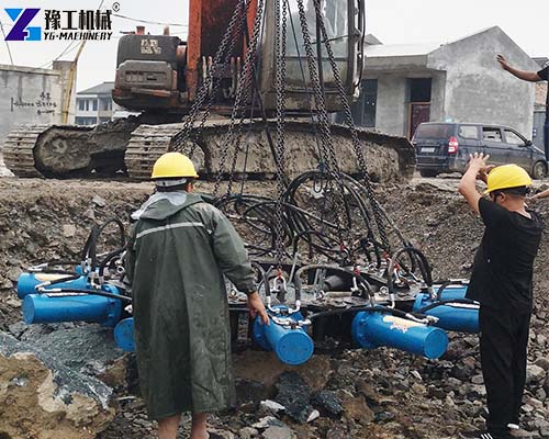 Excavator Demolition Attachments pile breaker machine onsite worker installation